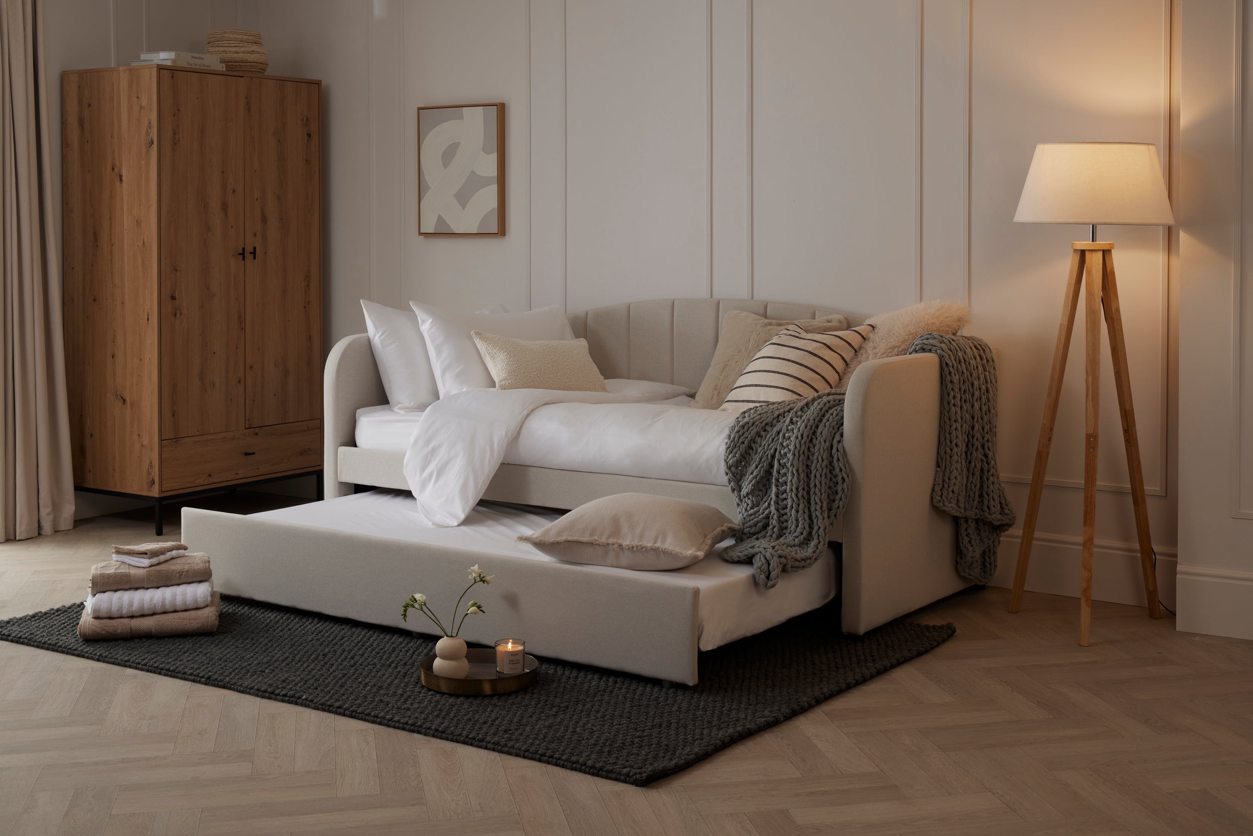Day bed in a neutral room, ready for guests